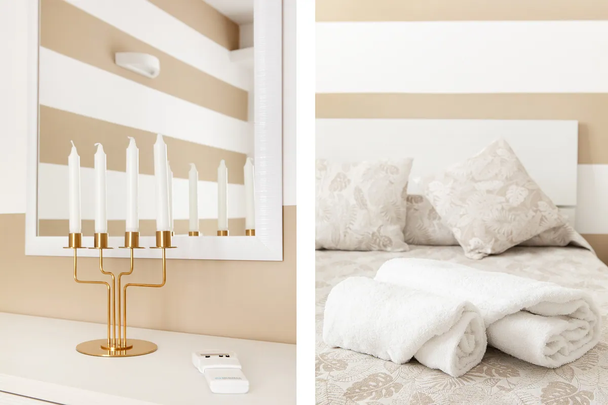 Dettagli: candelabro e biancheria da letto